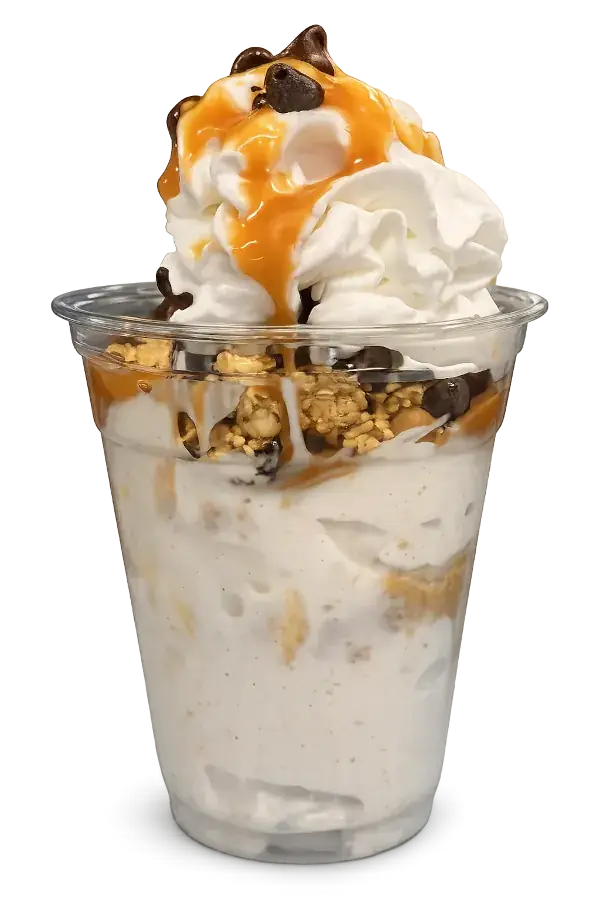 Honey nut yogurt parfait with granola, chocolate chips, whipped cream, and caramel drizzle